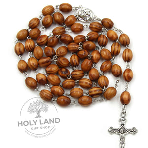
                  
                    Load image into Gallery viewer, handmade Four Hearts Olive Wood Rosary with Jerusalem Soil Top View
                  
                