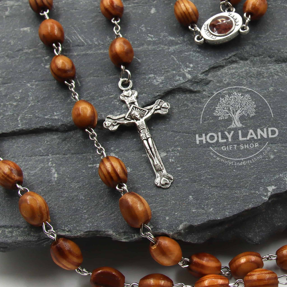 
                  
                    Load image into Gallery viewer, handmade Four Hearts Olive Wood Rosary with Jerusalem Soil Front View
                  
                
